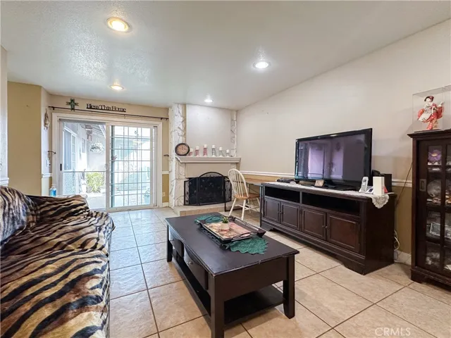 Living Room with Fireplace and Courtyard Slider