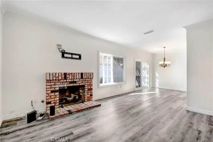 Living Room gas fireplace and slider to the private patio