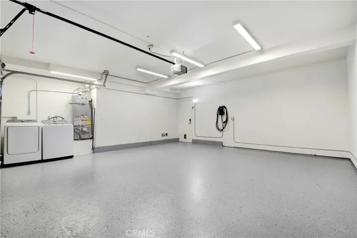Oversized 2 car garage; new epoxy floors; washer/dryer and EV charging station