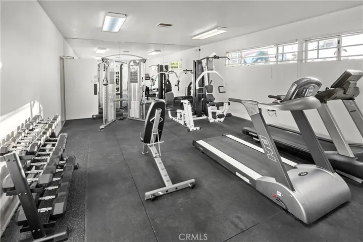 Fully equipped gym facility and bathroom.