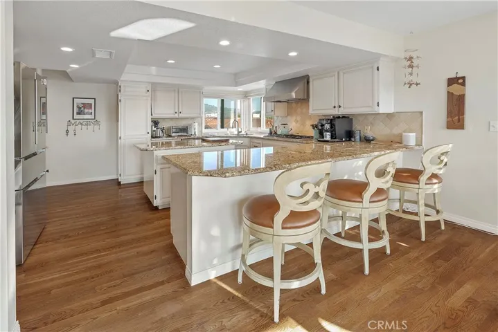 Kitchen features great workspaces and loads of counters. Breakfast Bar



The Kitchen is light and open to the family room and features top of the line appliances.