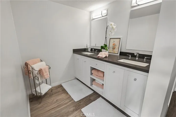 Double vanities and another beautifully renovated bathroom.