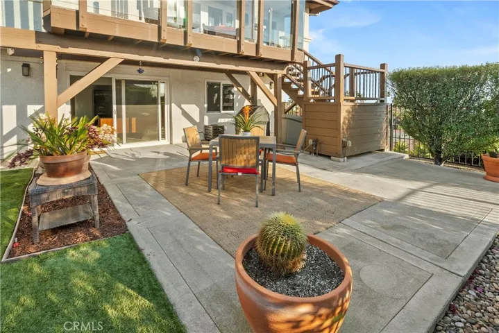 Backyard features artificial grass for easy maintenance, large outside patio and places to entertain on the upper deck and below.