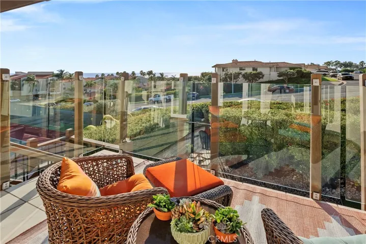 Easy access from second level to backyard and this elevated patio offers panoramic views of the ocean.