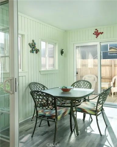 Downstairs sunroom with access to outdoor patio and BBQ area