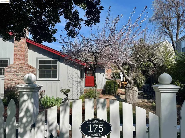 View of front of property featuring fence and board and batten siding