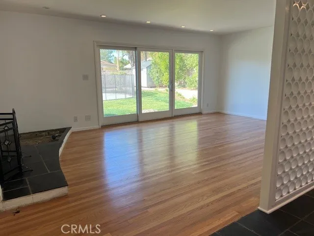 Living room with light oak hardwood floors
