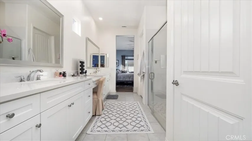 Primary bathroom w/ water closet and walk-in shower