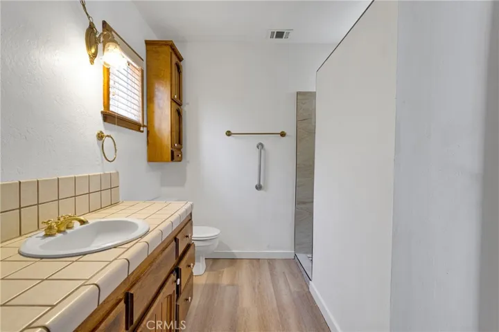 Primary bath REFRESH w/ brand new walk in shower!