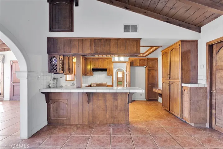 Kitchen open to dining room/den