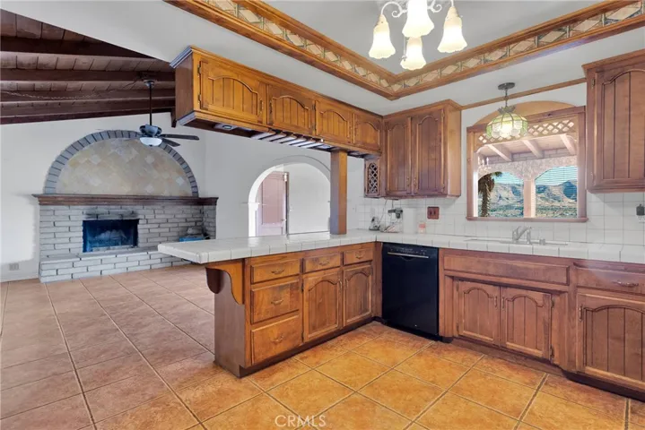 Lovely fireplace off kitchen