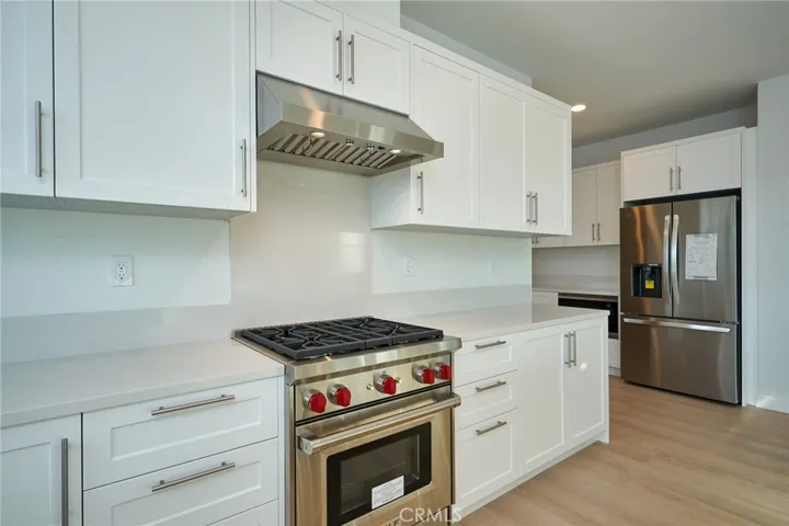 Gourmet kitchen w/Wolfe Gas Range and top of the line appliances throughout.