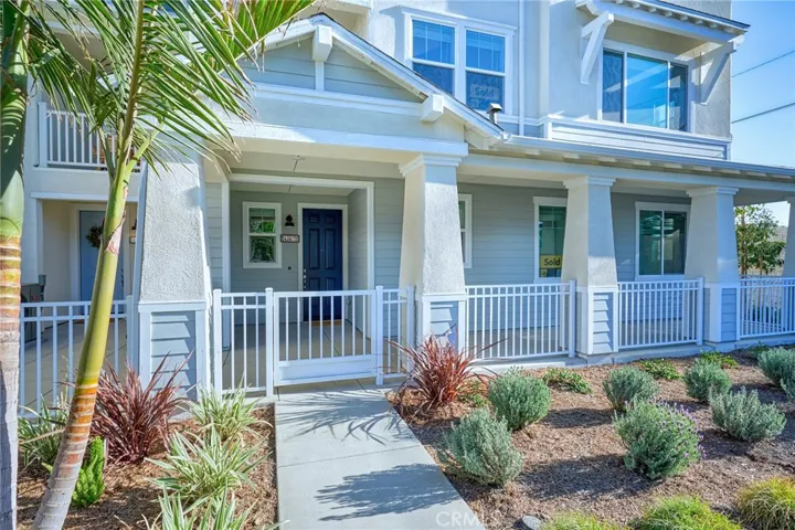 Huge private front porch extends the full length of the Townhome
