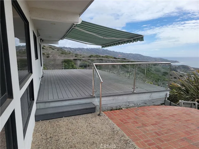 Backyard deck with awning extended