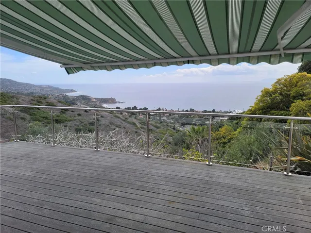 Backyard deck with awning extended