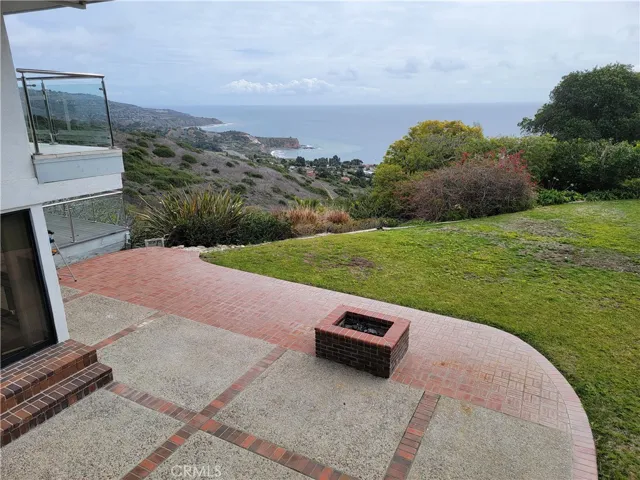 View from Veranda showing firepit and ocean