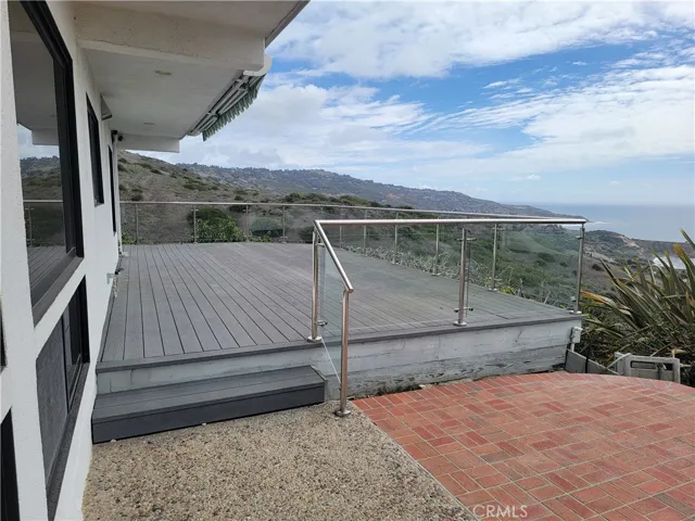Backyard deck with awning retracted