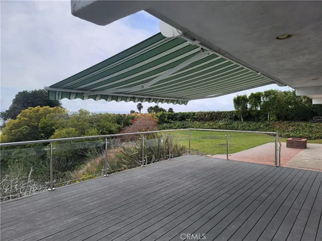 Backyard deck with awning extended