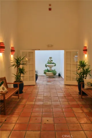 Interior courtyard entry behind secure doors provides extra safety for delivered packages and mail.