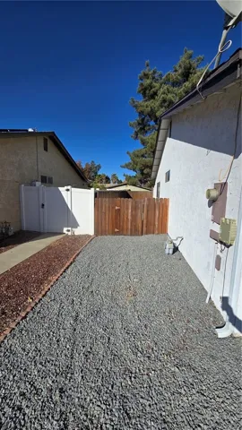 Left side of property.