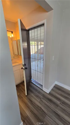 Primary Bedroom Patio Door Entrance with locking security screen door.