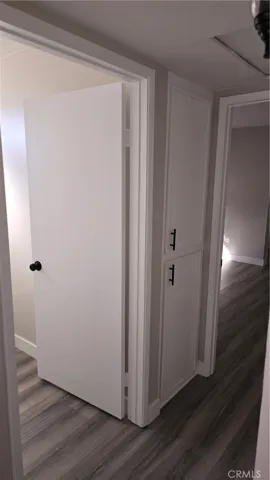 2nd linen cabinet before entrance to Primary Bedroom.