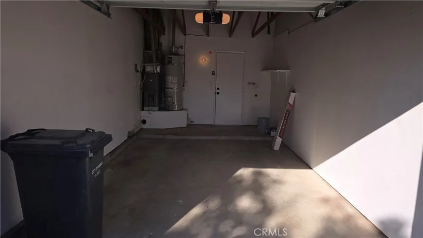 1 Car Garage with automatic garage door opener and entrance to kitchen.