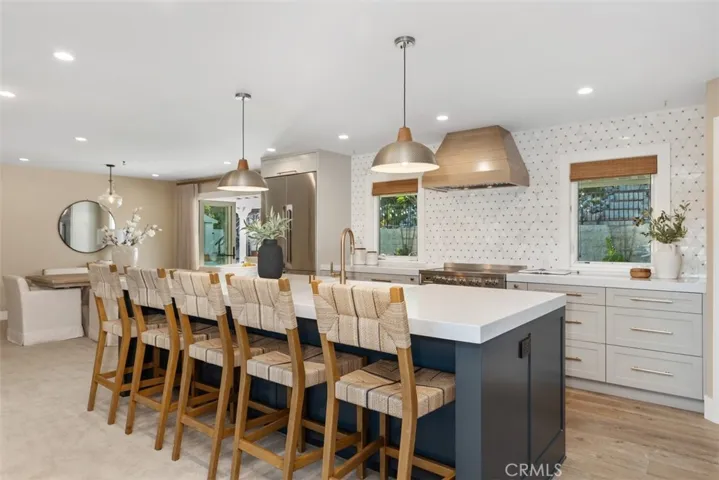 Beautifully redone kitchen with custom finishes.