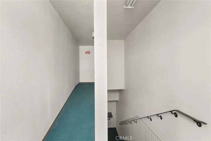 Stairway and hallway to  emergency exit upstairs