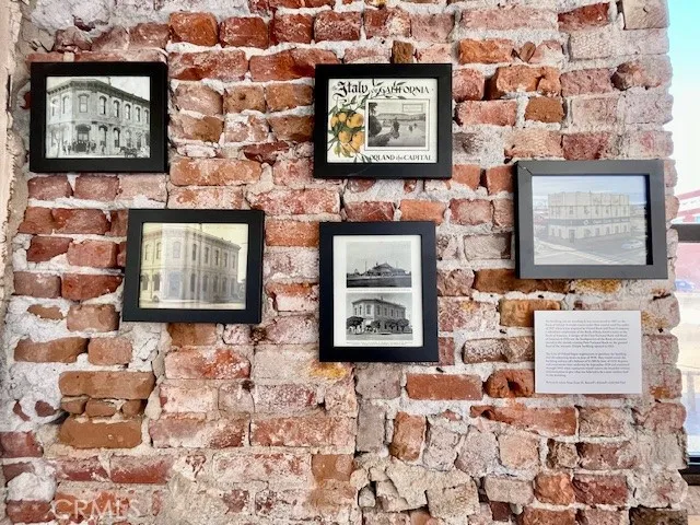 Downstairs exposed brick and history wall
