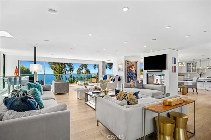 Floor-to-ceiling walls of glass, multiple fireplaces and bespoke finishes and fixtures shine throughout.
