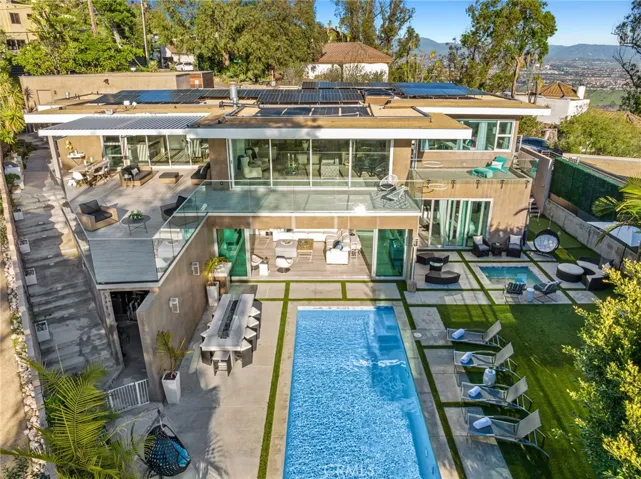 Mature trees and lush landscaping complement the phenomenal backyard, which is home to a saltwater infinity pool and spa, and a Fire and Ice bar for fun-filled gatherings.