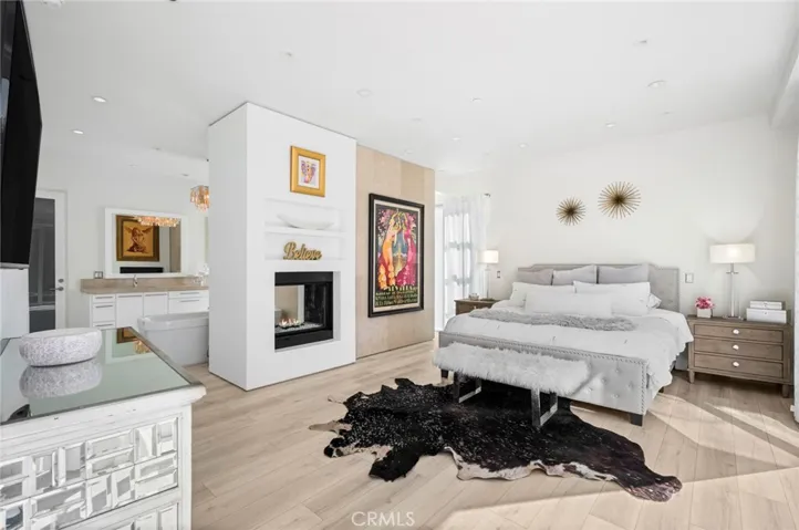 The main primary suite is located on this level and boasts backyard access, a fireplace, generous walk-in closets and a spa-worthy bath, creating the feel of an exclusive luxury resort.