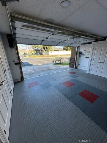 Garage with cabinet and storage room