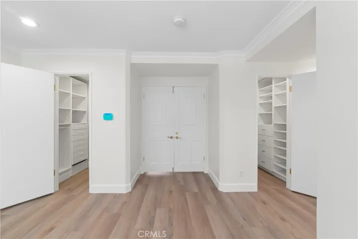 Primary Bedroom Walk in Closets