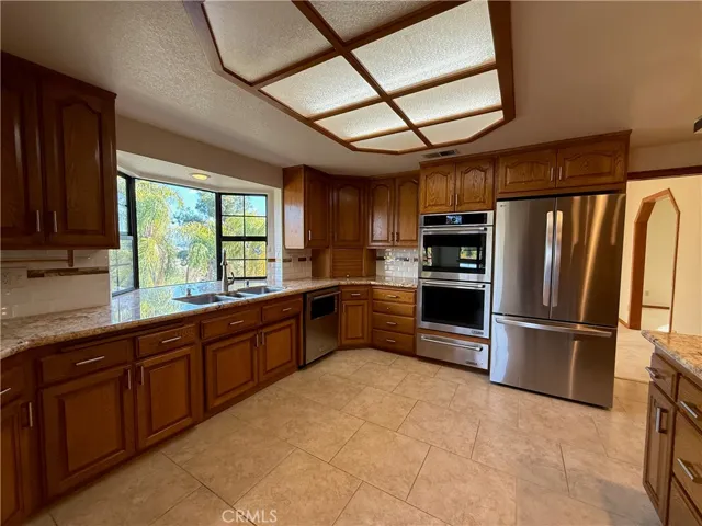 Roomy kitchen with door to dining room. Door to living room visible on right