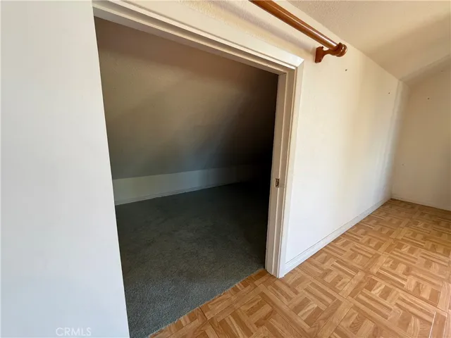 Finished storage closet under eaves of bonus room/hobby room over workshop