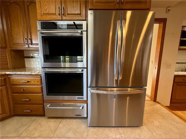 Jennair double ovens plus a warming/bread proofing drawer.