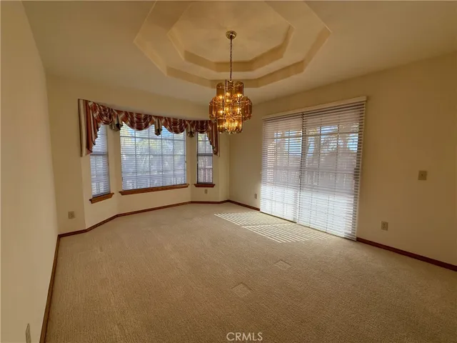 Dining room with sliding doors to wraparound deck porch alcove for seating area