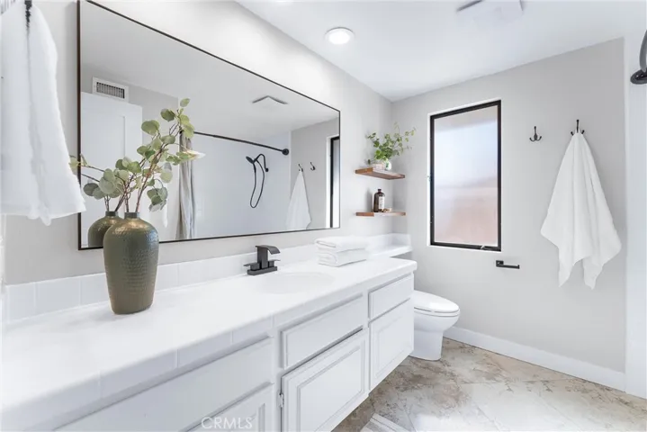 UPPER LEVEL GUEST BATHROOM WITH SHOWER TUB