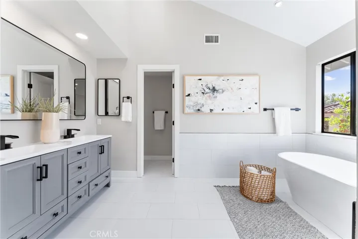 PRIMARY BATHROOM WITH SHOWER AND BATH + DUAL SINKS