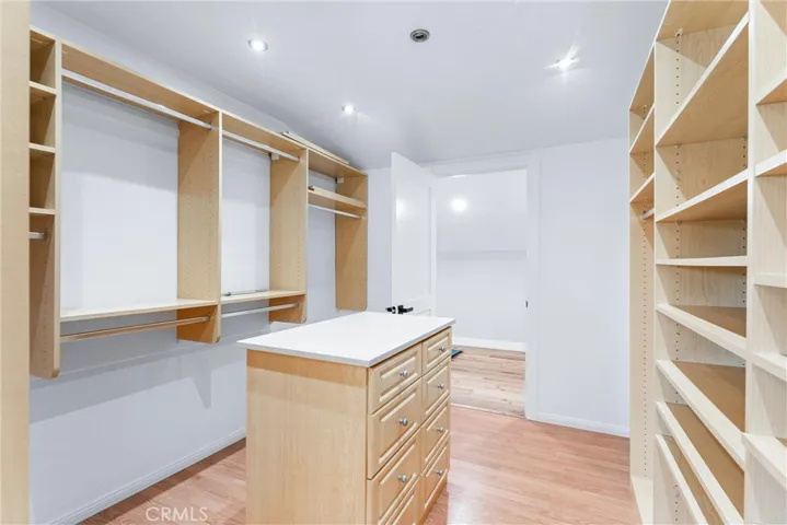 LARGE WALK-IN CLOSET WITH ACCESS TO HIDDEN BONUS ROOM