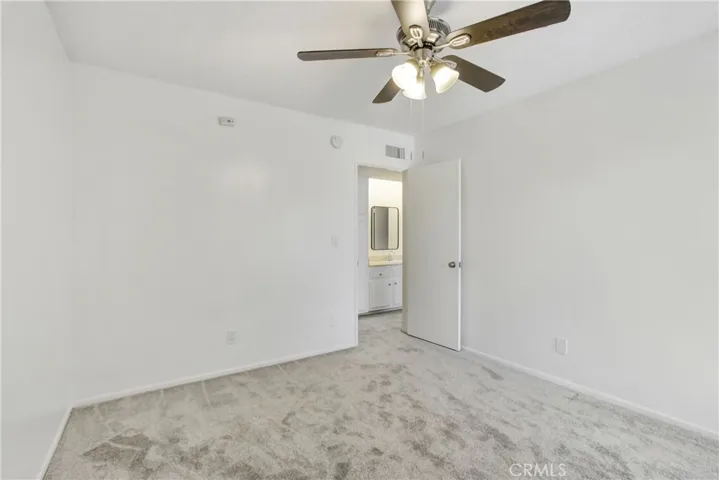 Brand new vertical blinds and ceiling fan to go with the new carpets