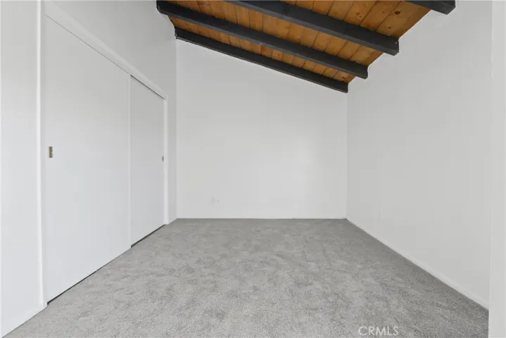 The bonus, Den area, with its high ceiling and beautiful beams could be an office, play area, or a bedroom