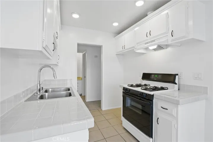 Double stainless steel sink with disposal, cabinets and drawers to your heart's content