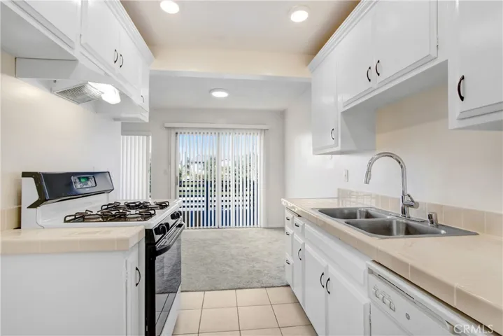 Kitchen looking out to nook and balcony