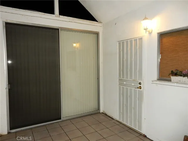 Back patio entry. Slider is off the main bedroom and the Screen door leads to the kitchen.