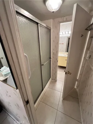Step down shower between the two half baths.