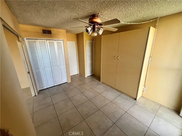 Closet for the second bedroom. Door leads to the bathroom.