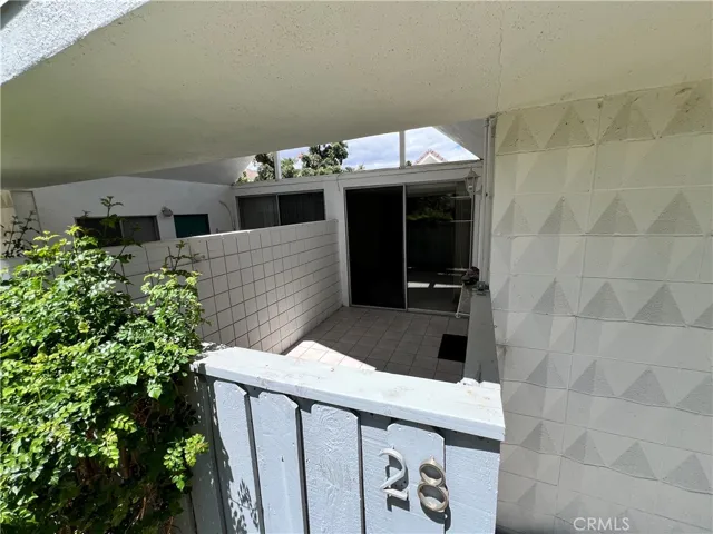 Rear patio area and entry to the bedroom and kitchen.